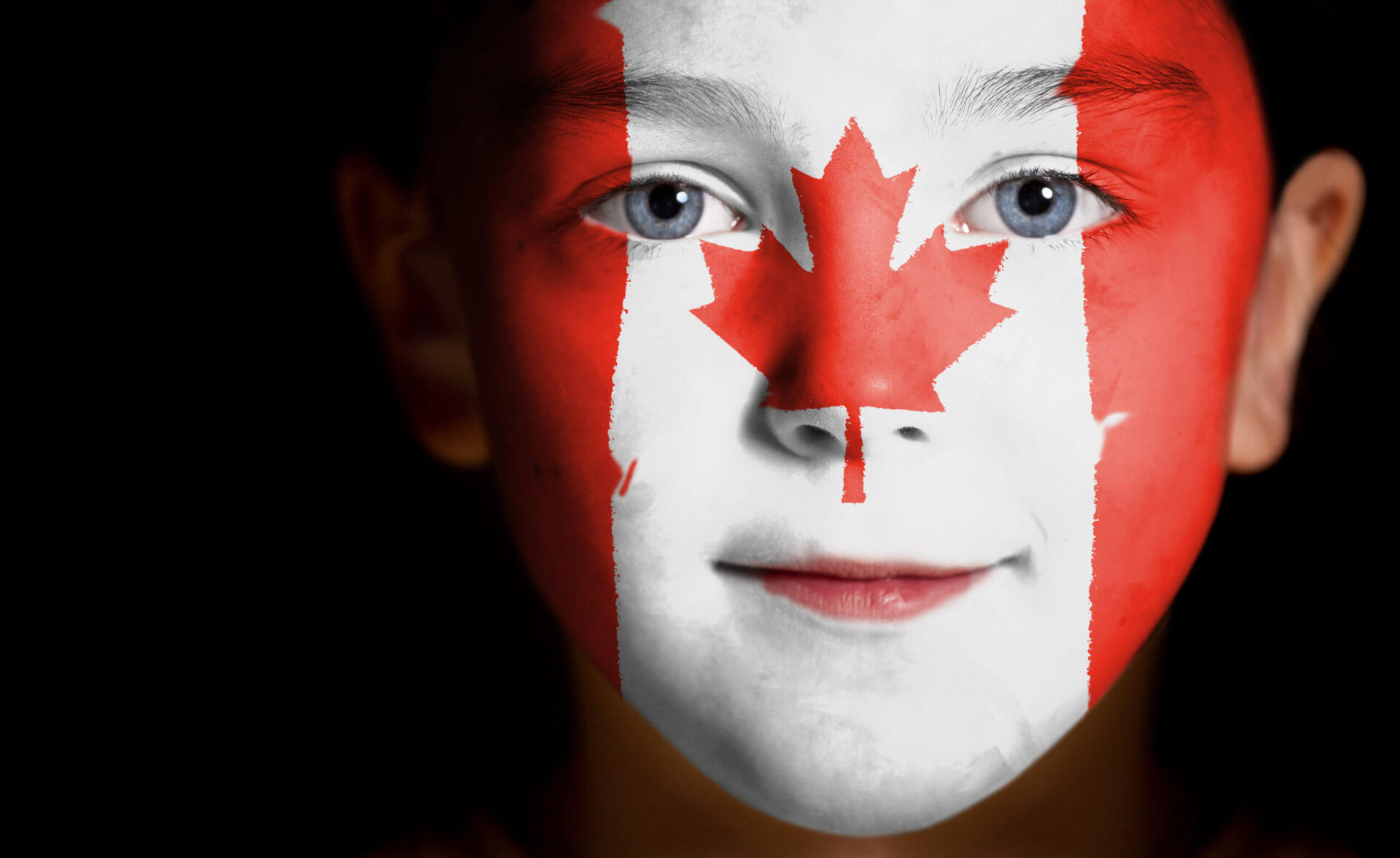 child-with-a-painted-canadian-flag